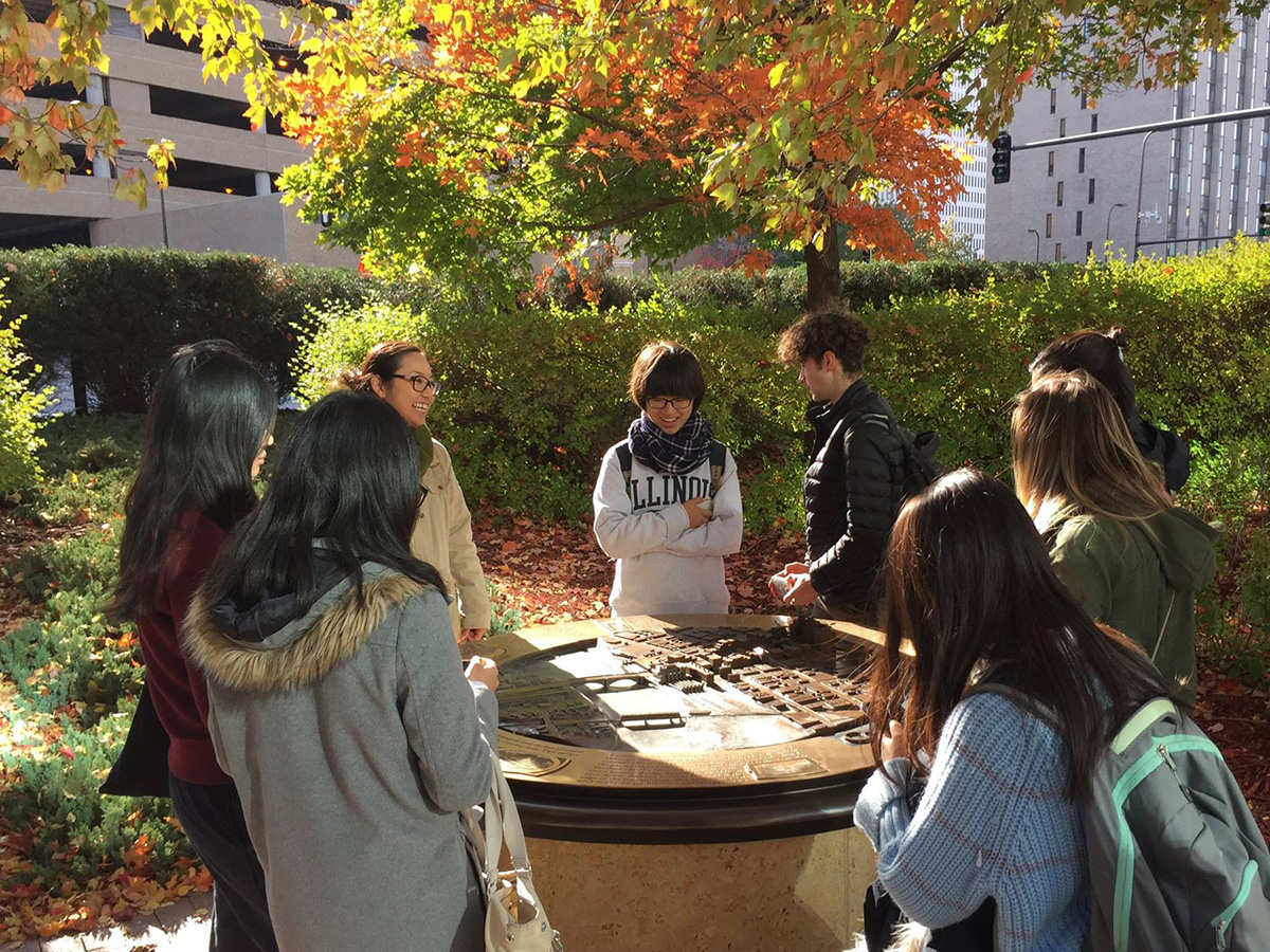 Students visit Minneapolis riverfront site with Satoko Muratake of firm Ten x Ten.