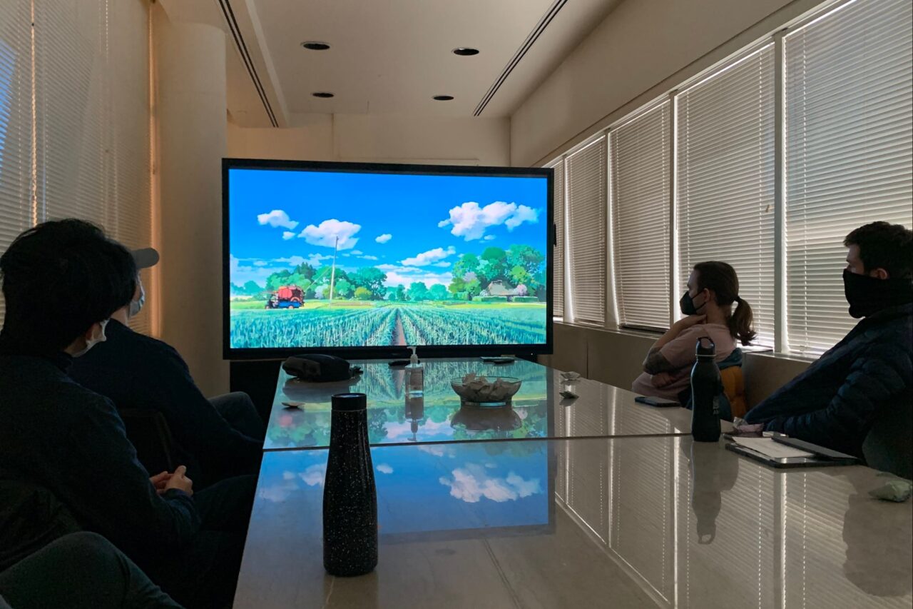 Students viewing anime film on 86" 4K interactive touch sccreen monitor.