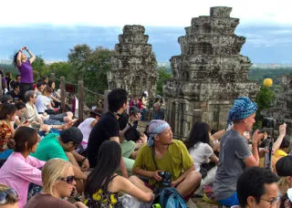 Photo of pilgrims and tourists at Phnom Bakheng, Siem Reap Province, Cambodia