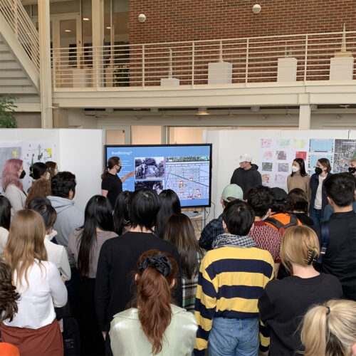 Students using a new touch screen at 2022 Charrette "Center Connect"