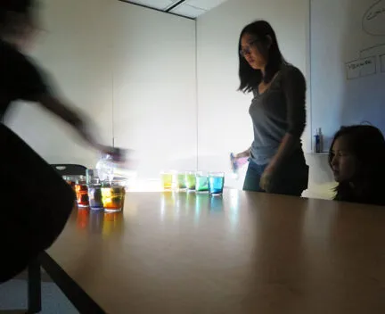 Photo of students experimenting with tinted water