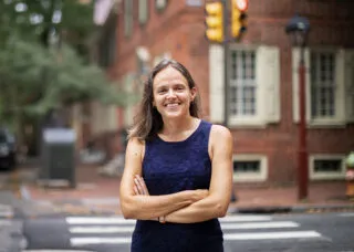 Portrait of Francesca Ammon standing near a street corner in Philadelphia, PA