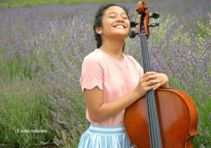 Student Holding a Cello