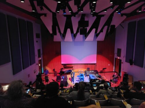 UIUC Faculty Josh Graham, percussion, Nicki Roman, saxophone, and Bernhard Scully, horn, perform Kerem Ergener's In Praise of Shadows in the Music Building Auditorium on Sept. 5, 2025 at PdMaxCon25~.