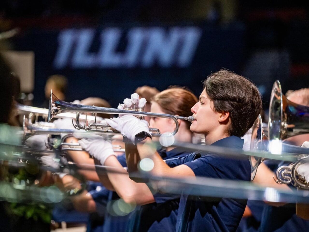 Marching Illini trumpet line in blue shirts