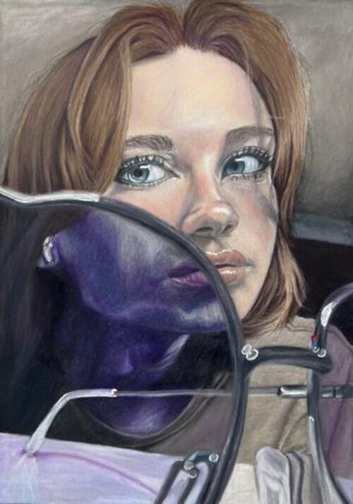 self-portrait partially seen through purple sunglass lens