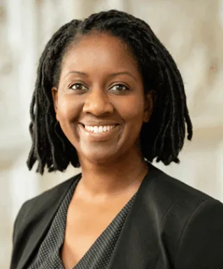 woman with black hair smiling