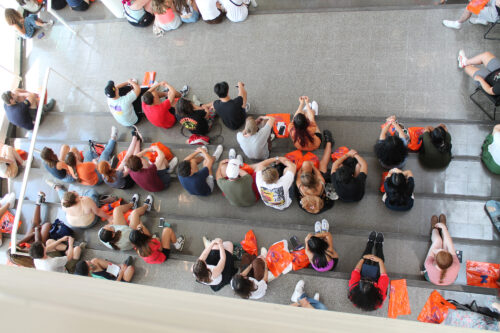 top down view of large group of students in TBH for new student welcome