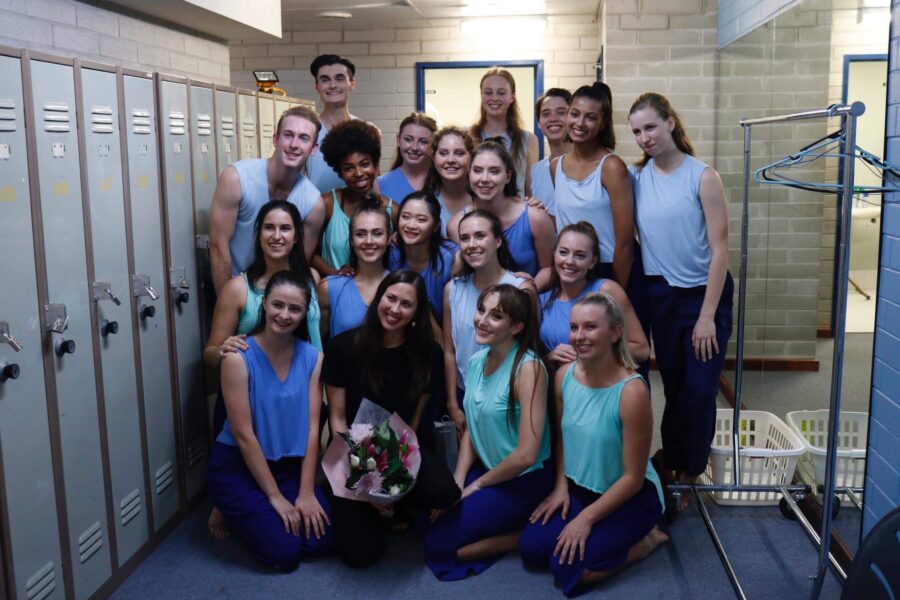 group of students posing in locker room