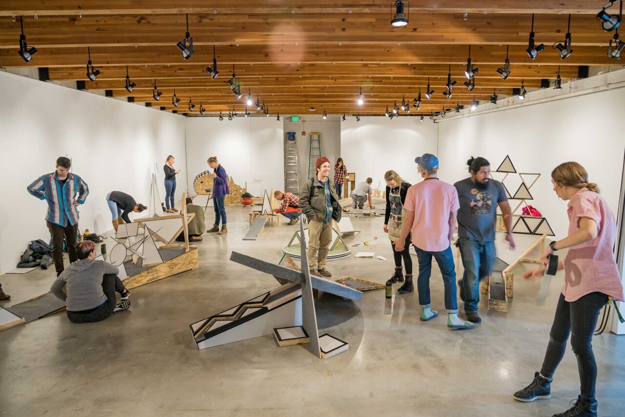 Landscape architecture students setting up an exhibit