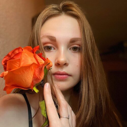 self-portrait with red flower