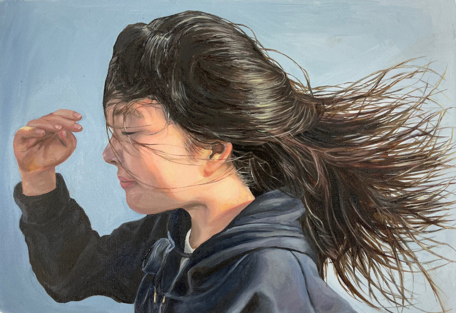 self-portrait in profile with blowing dark hair