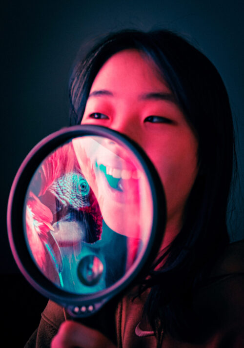 self-portrait with magnifying glass