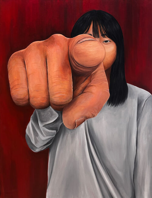 self-portrait with pointing finger in foreground