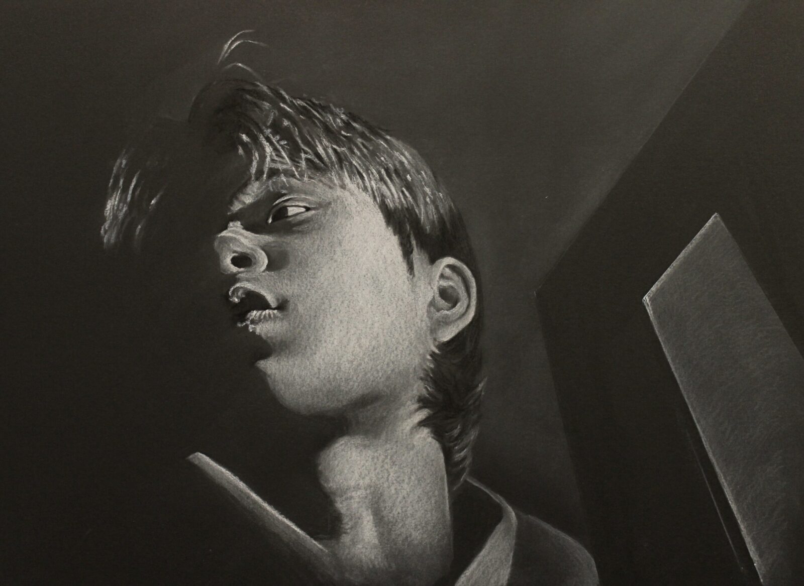 self-portrait in black and white of head seen from below