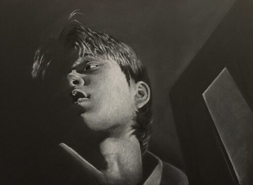 self-portrait in black and white of head seen from below