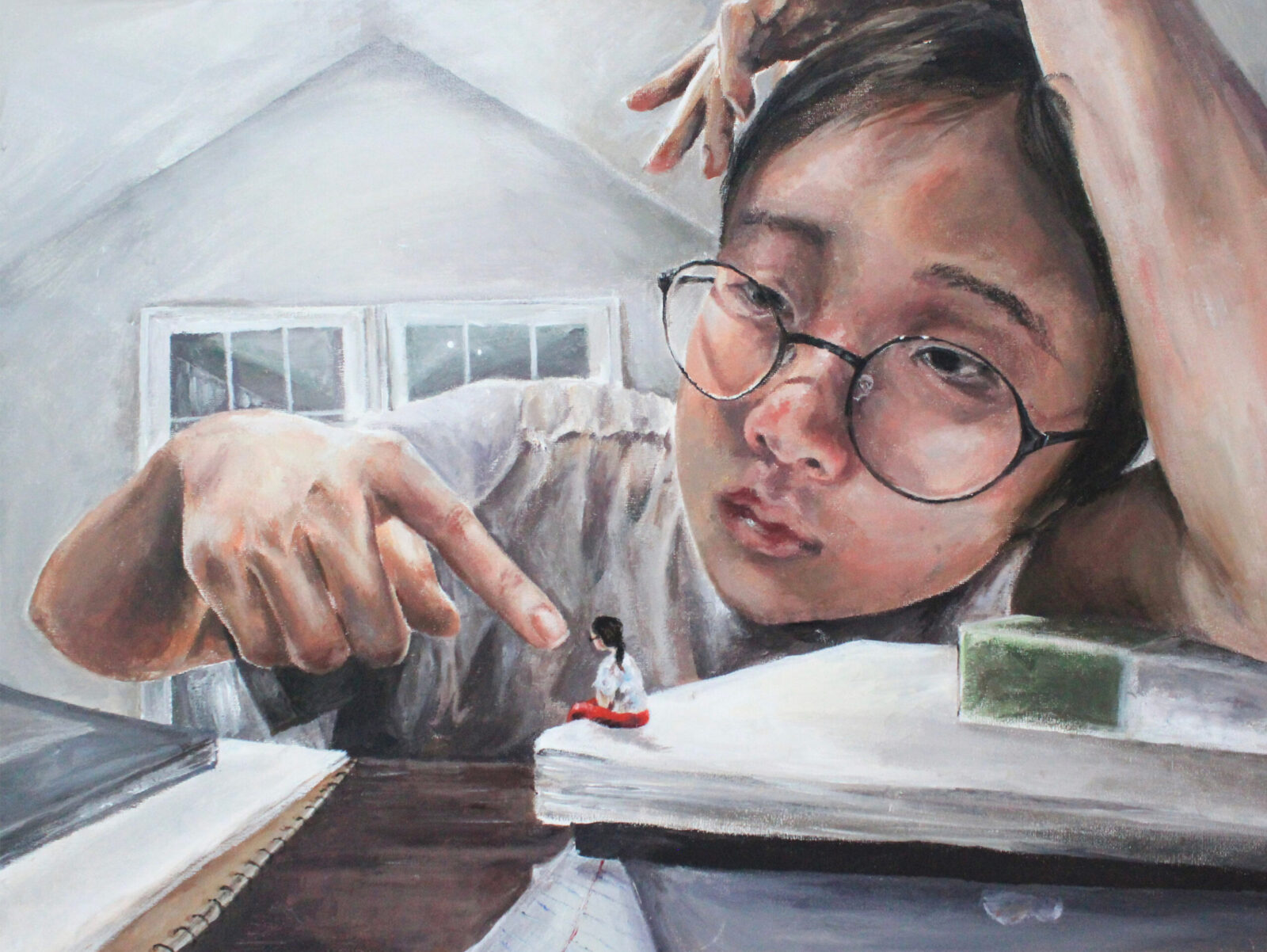 self-portrait slumped on books and pointing at tiny person