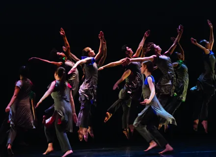 students onstage dancing