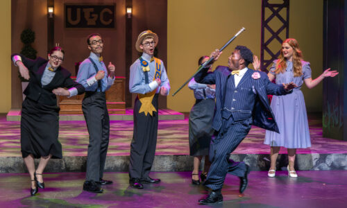 Dancing in front of a group in Urinetown, Department of Theatre, November 2022, Photo by Darrell Hoemann