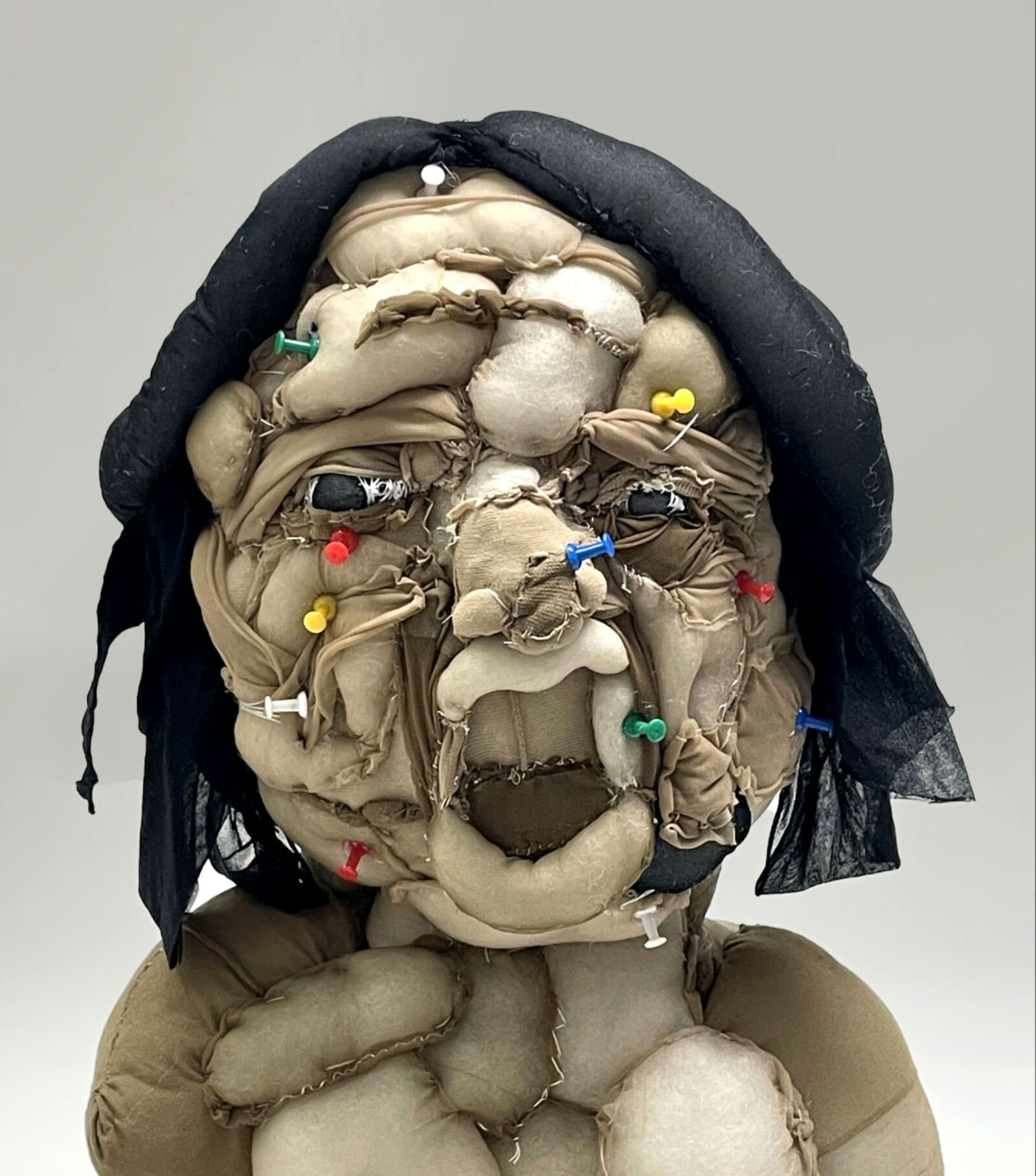 self-portrait using fabric-covered foam and push pins