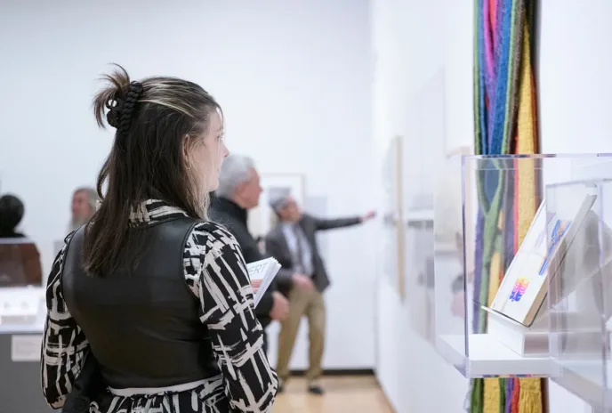 Woman looking at artwork in museum