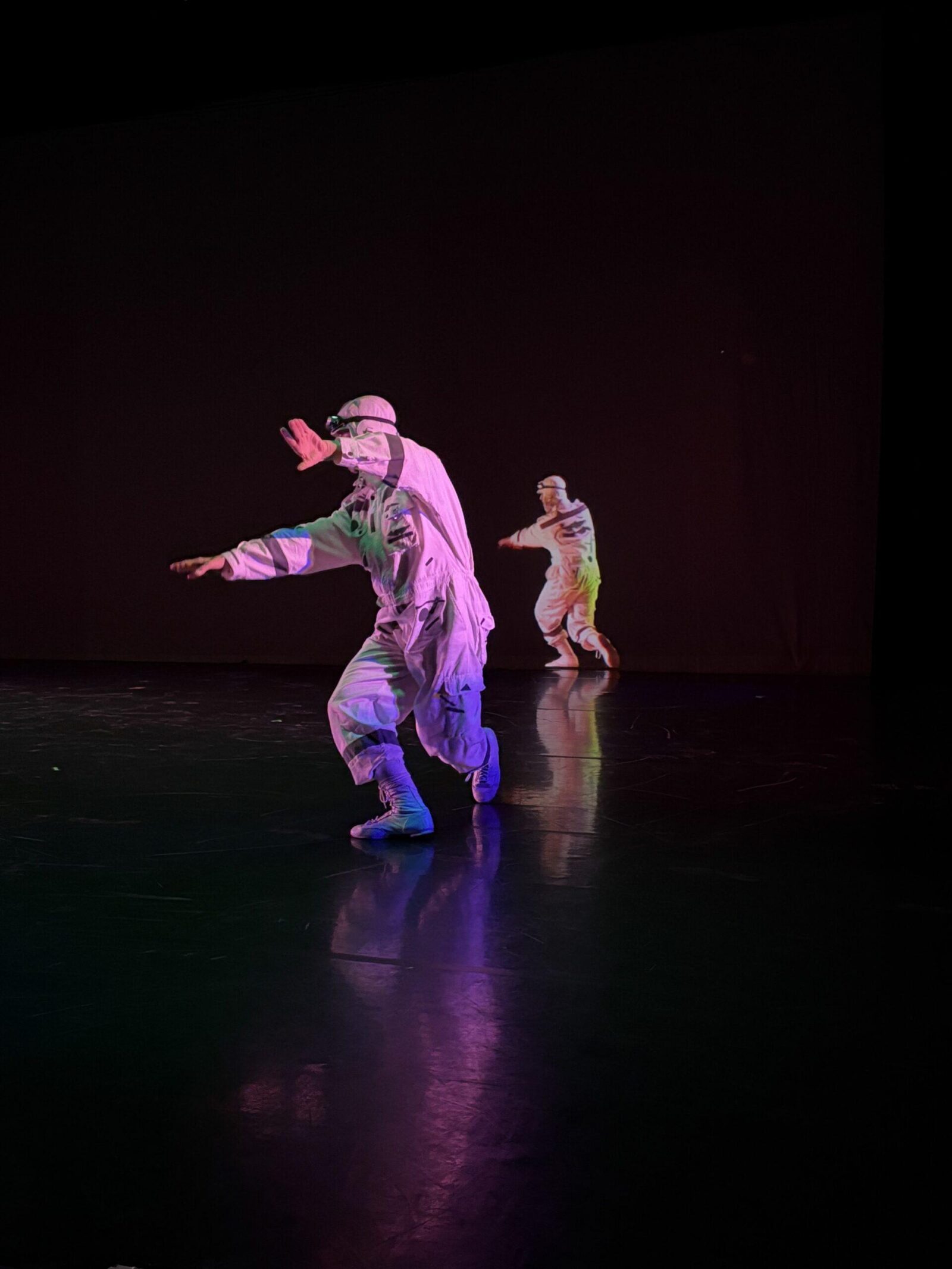2 people dance on a stage
