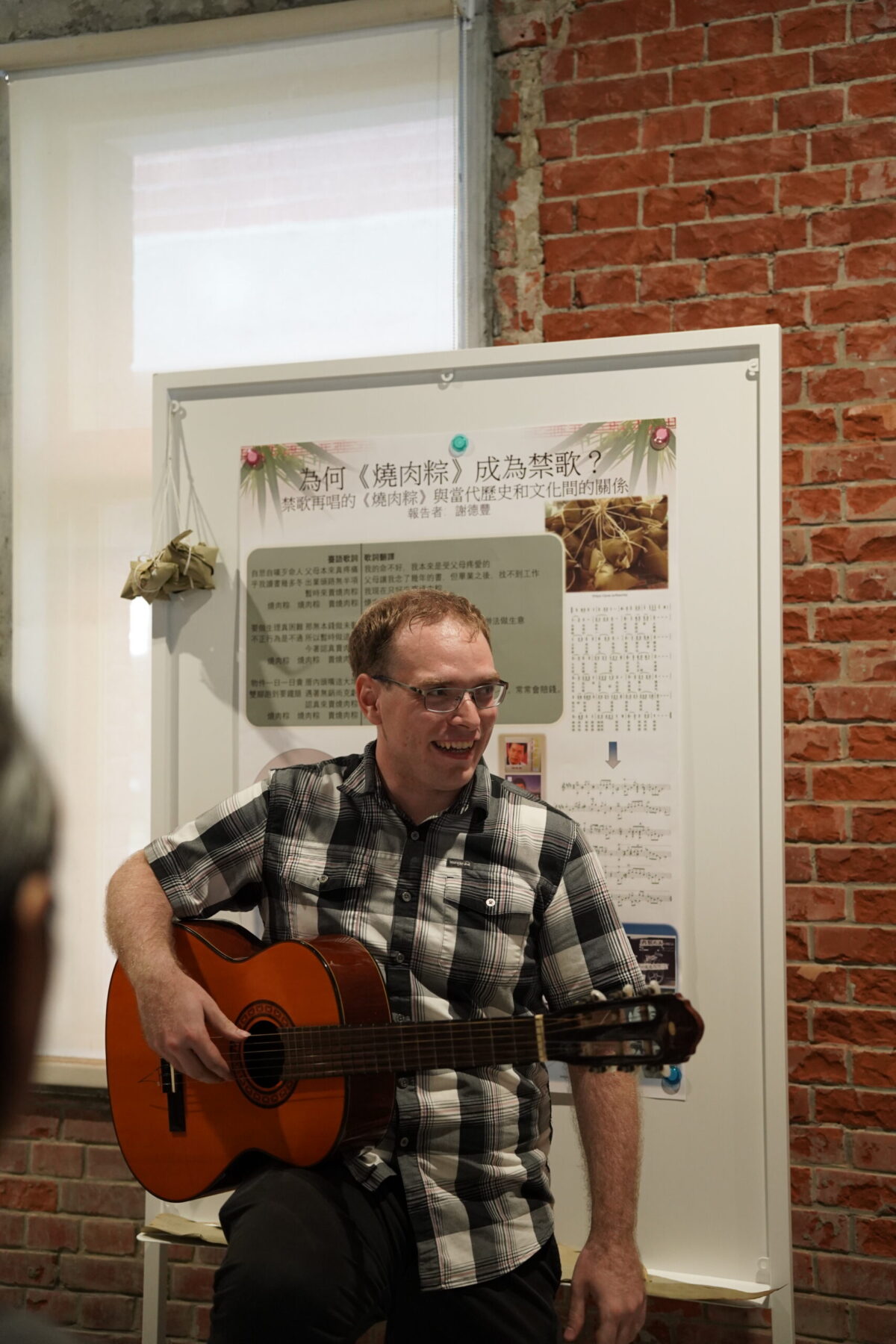 person paying the guitar