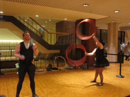 people juggling and throwing rings