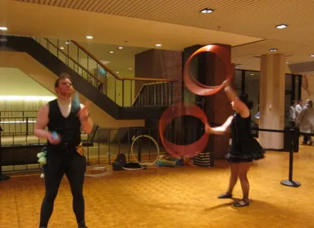 people juggling and throwing rings