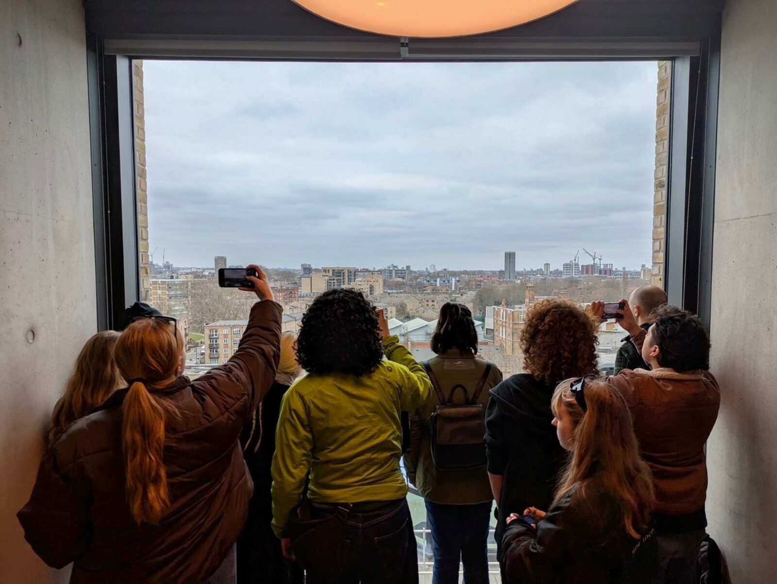 people looking out a window