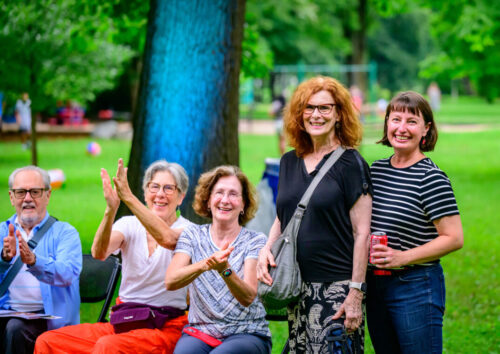 several people stand together outside