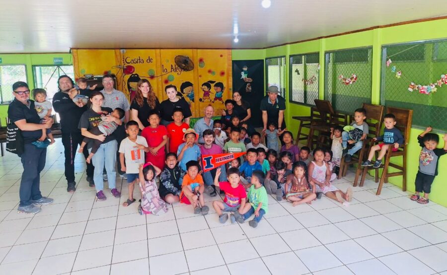 many people gathered on white tile sitting and standing