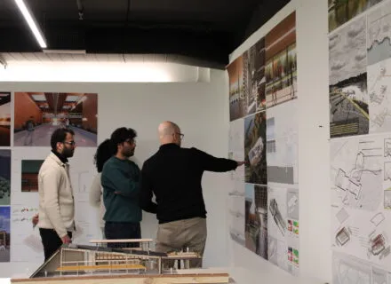 people gathered looking at posters