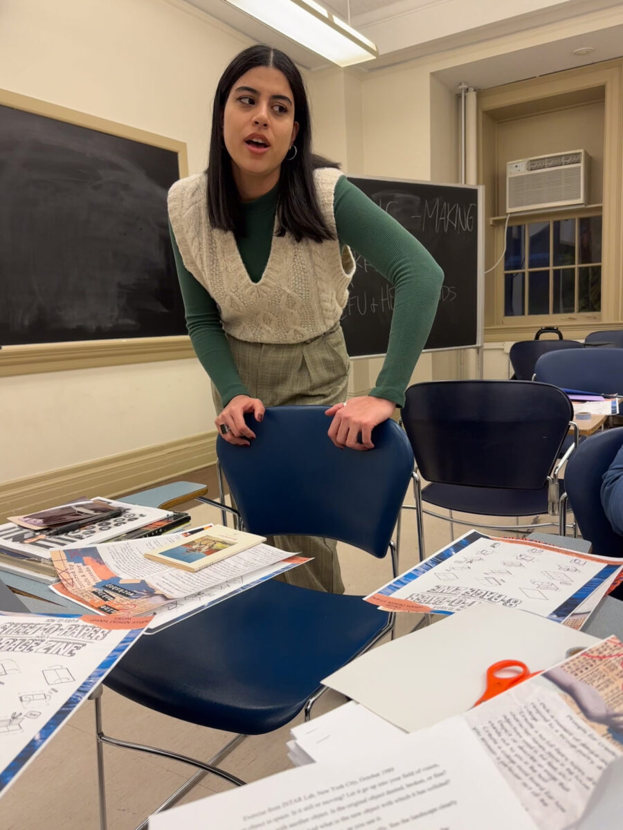 person leans over a chair