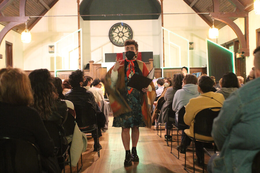 an actor walks down the audience aisle