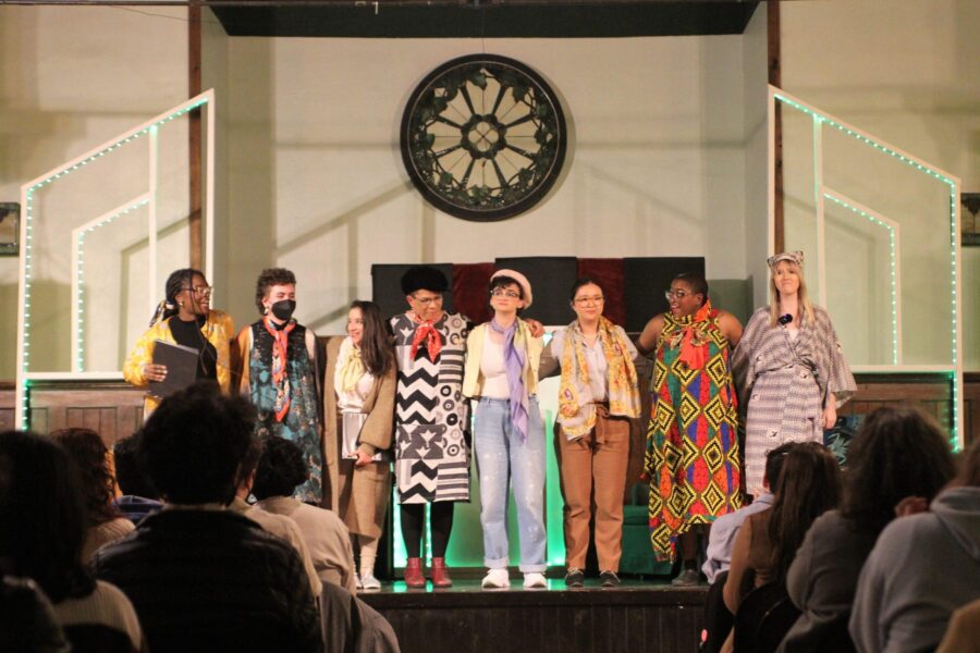 actors lined up on stage to take a bow