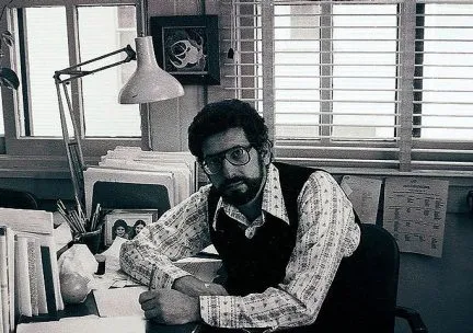 Len Heumann at his desk