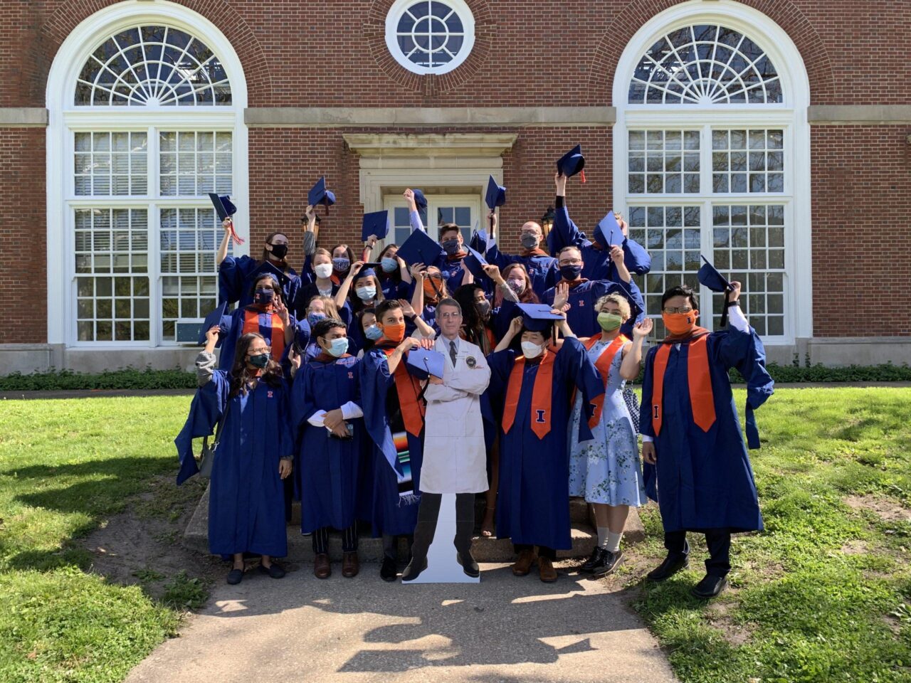 MUP graduates posing on steps