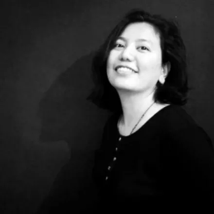 Black and white photo of Vinisha Singh Basnet in front of a dark background