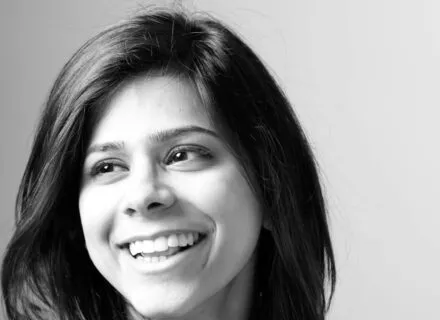 Black and white photo of Marwah in front of a white background