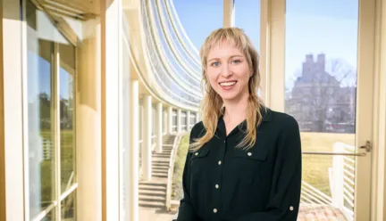 Rebecca Walker smiling at the camera in a building