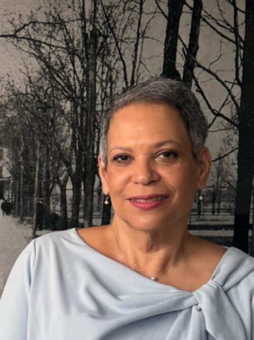 Photo of Hazel Edwards in gray dress against a wall