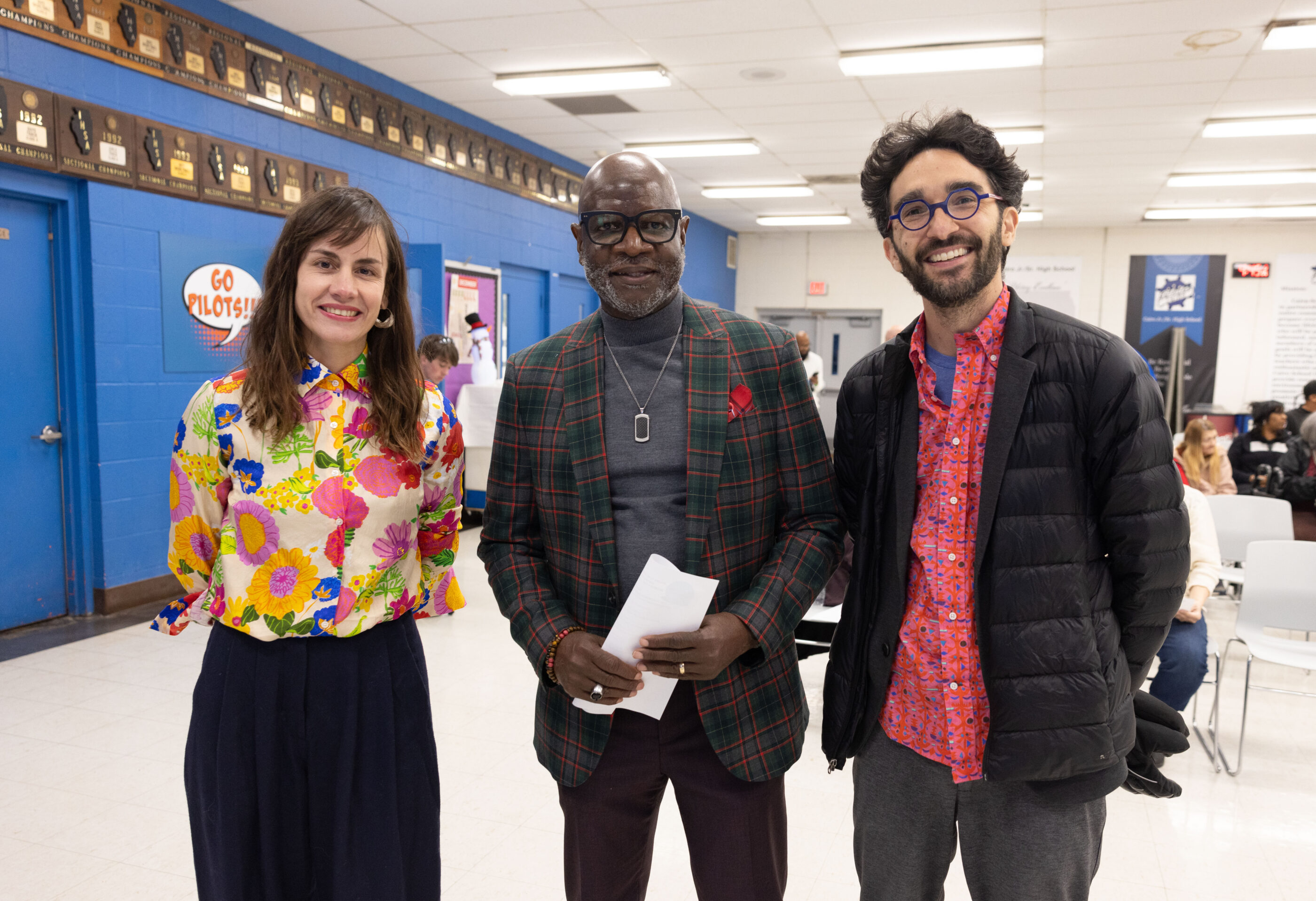 three people smiling