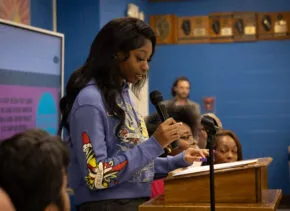 person speaking into a mic