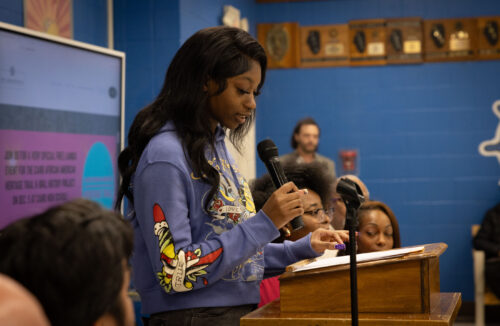 person speaking into a mic