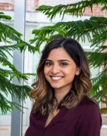 Headshot of Eshani Patel in front of pine trees 