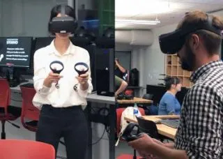 two students wearing virtual reality goggles