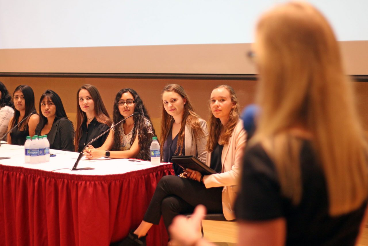 Attendees of the women's symposium at a table 