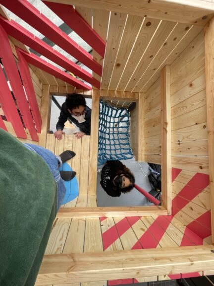 students assembling a wood installation