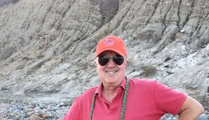 photo of doug gilpin standing on a rocky beach